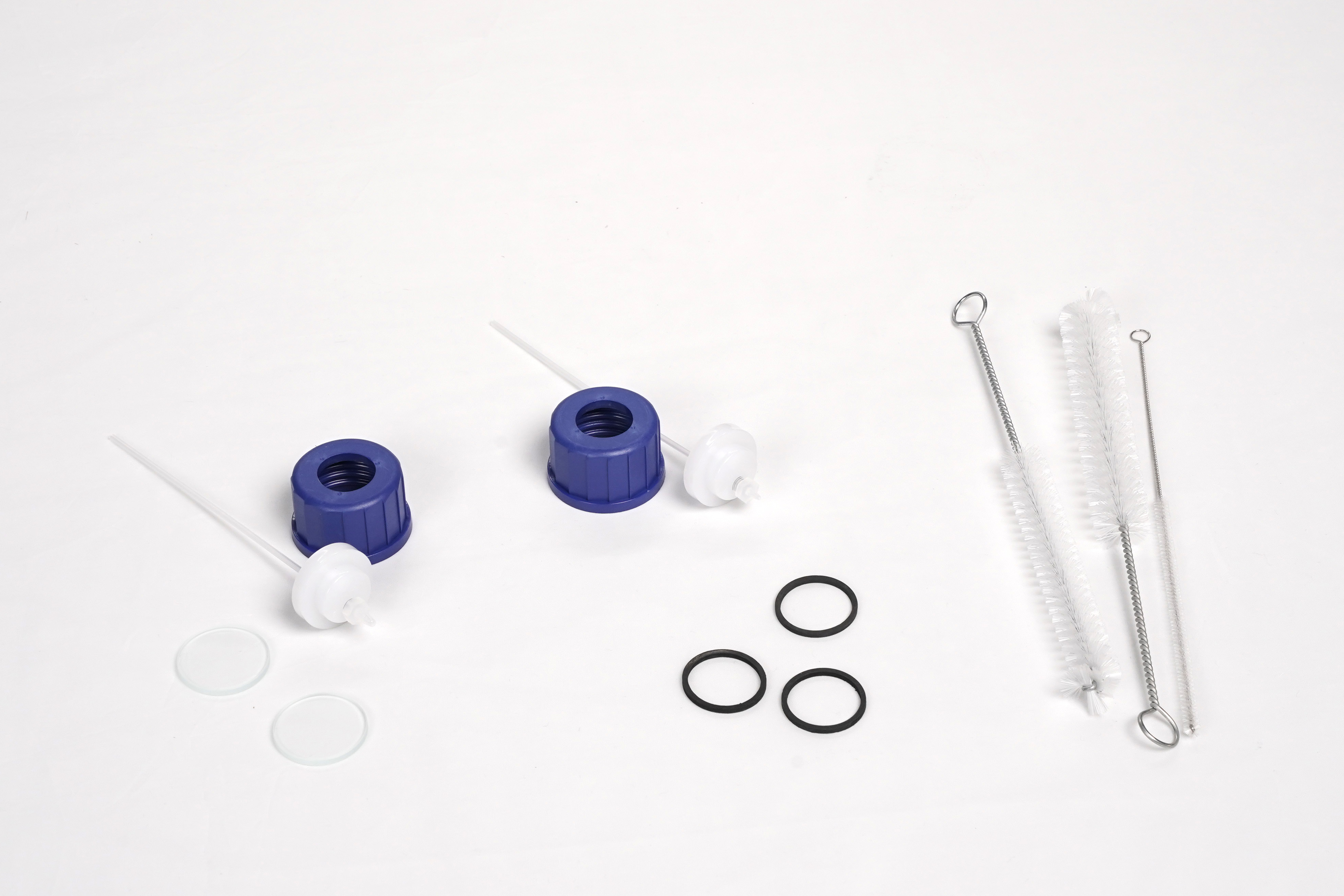 Annual service set professional Testomat® 808 SiO2 Jahres Service Set Professional Testomat 808 SiO₂ Komponentenbild mit Sichtgläsern, Gummidichtungen, Bürstensatz und blauen Schraubverschluss Einsätzen mit Saugrohren